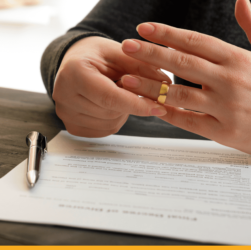 signing-divorce-papers-removing-ring
